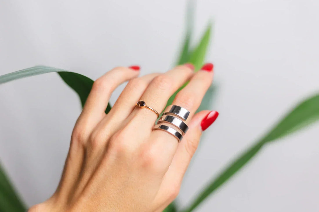 Wide silver wrap ring and thin gold band pairing