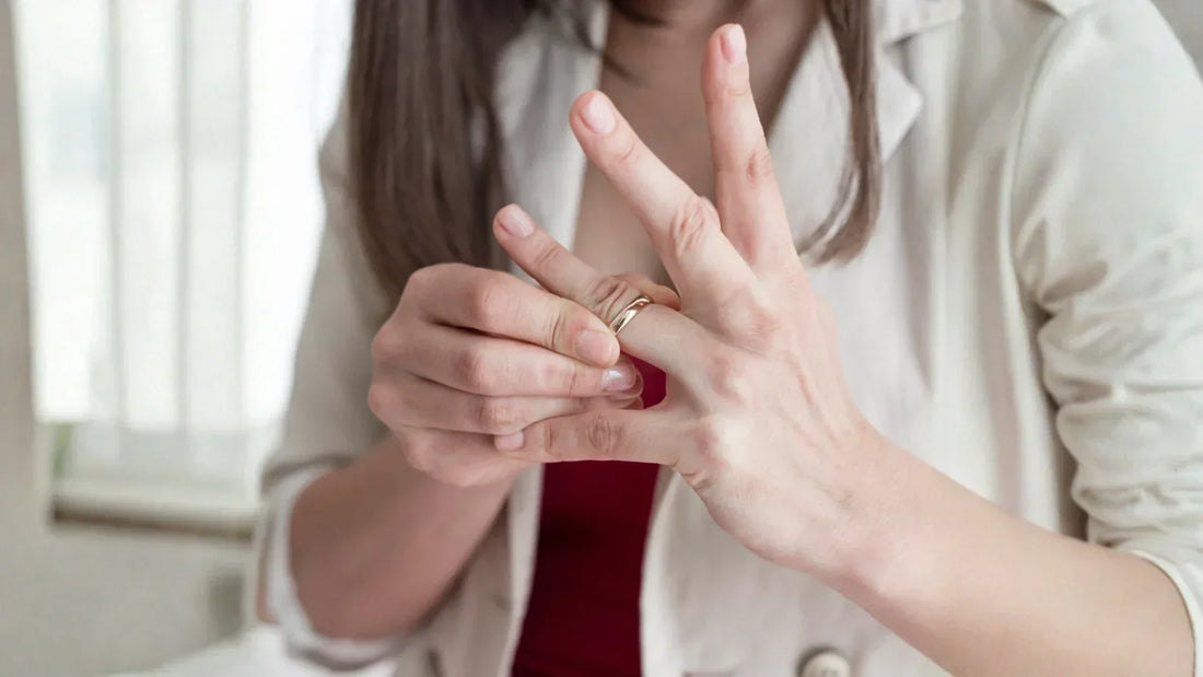 Person attempting to remove a tight ring from a swollen finger.
