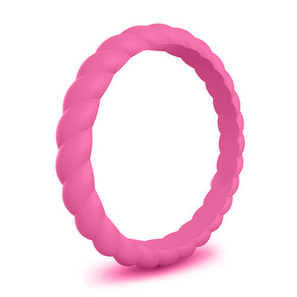 Hot pink silicone ring with twisted design on white background