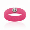 Hot pink silicone ring with a single clear gemstone and Gemslique branding