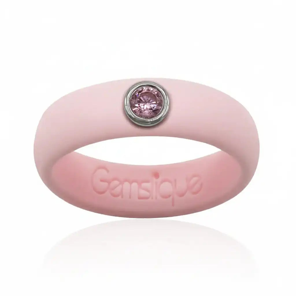 Pink silicone ring with single purple cubic zirconia gemstone and embossed Gemsique logo