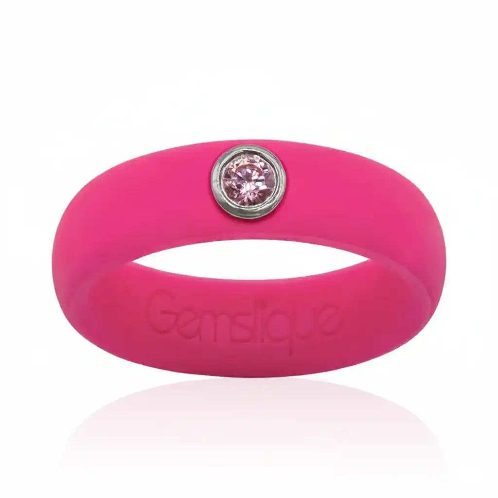 Bright pink silicone ring with a single pink cubic zirconia stone set in silver bezel