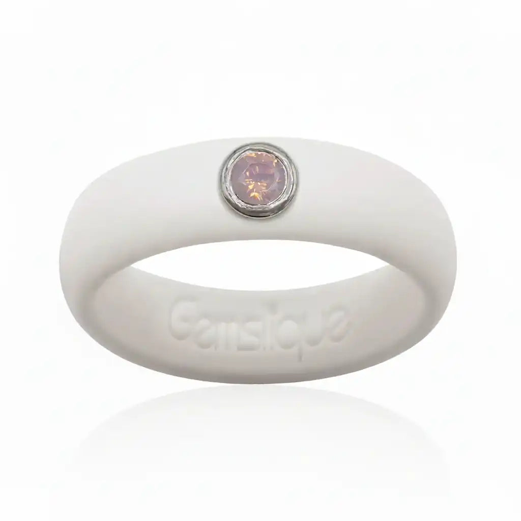 White silicone ring with a pink opal cubic zirconia stone set in silver bezel