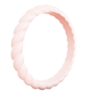 Light pink twisted silicone ring with smooth finish on a white background