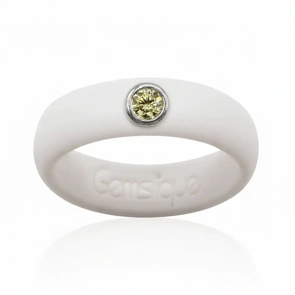 White silicone ring with yellow cubic zirconia stone set in silver bezel on top