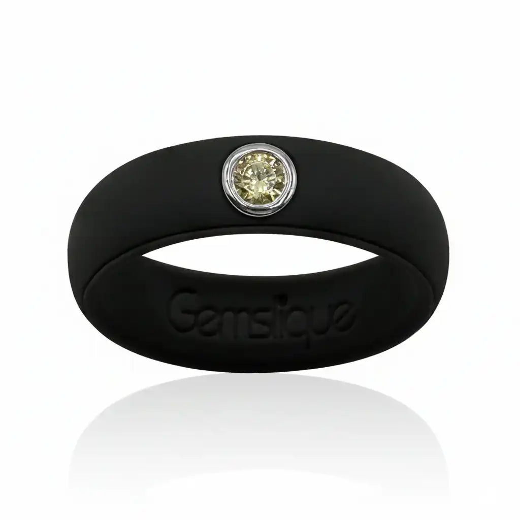 Black silicone ring with a single yellow cubic zirconia stone and Gemsique branding